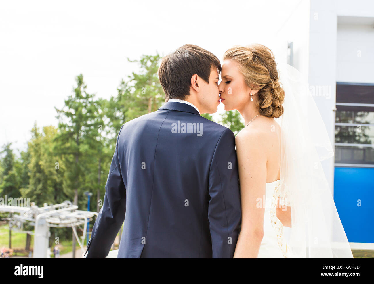 Wedding, Beautiful Romantic Bride and Groom Kissing Stock Photo - Alamy