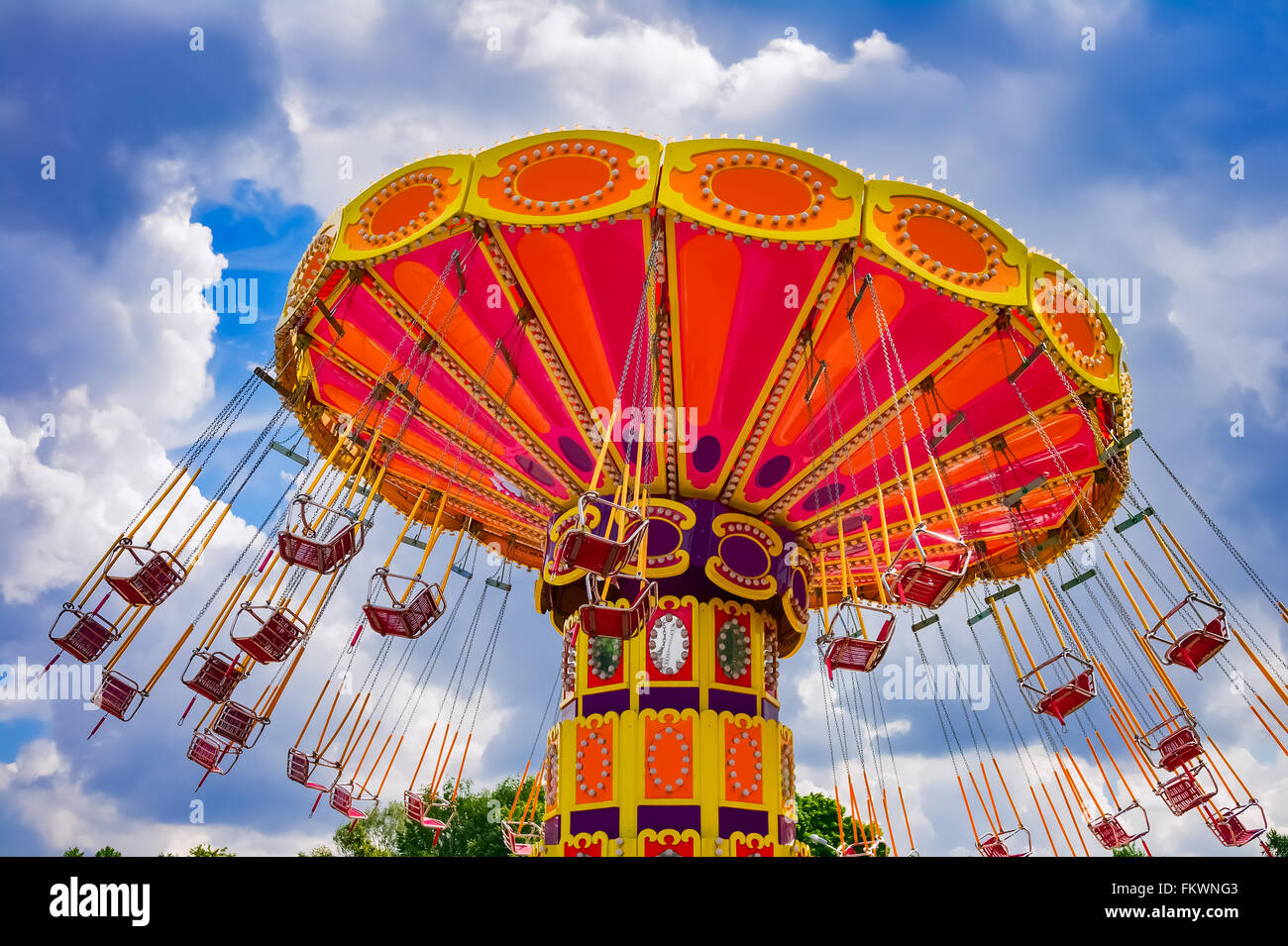 Colorful swing ride at the amusement park Stock Photo