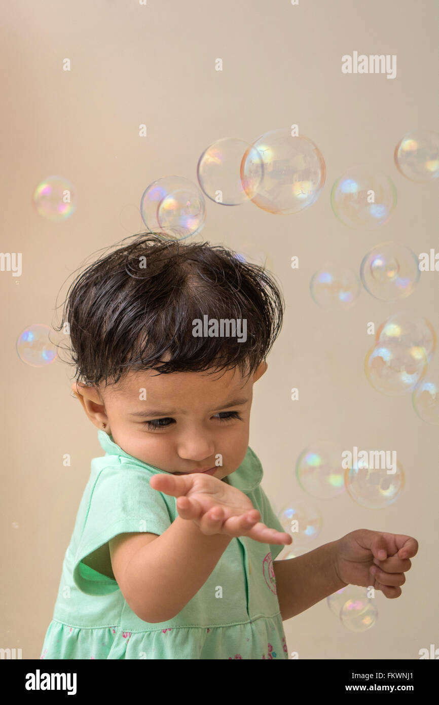 baby playing with bubbles Stock Photo Alamy