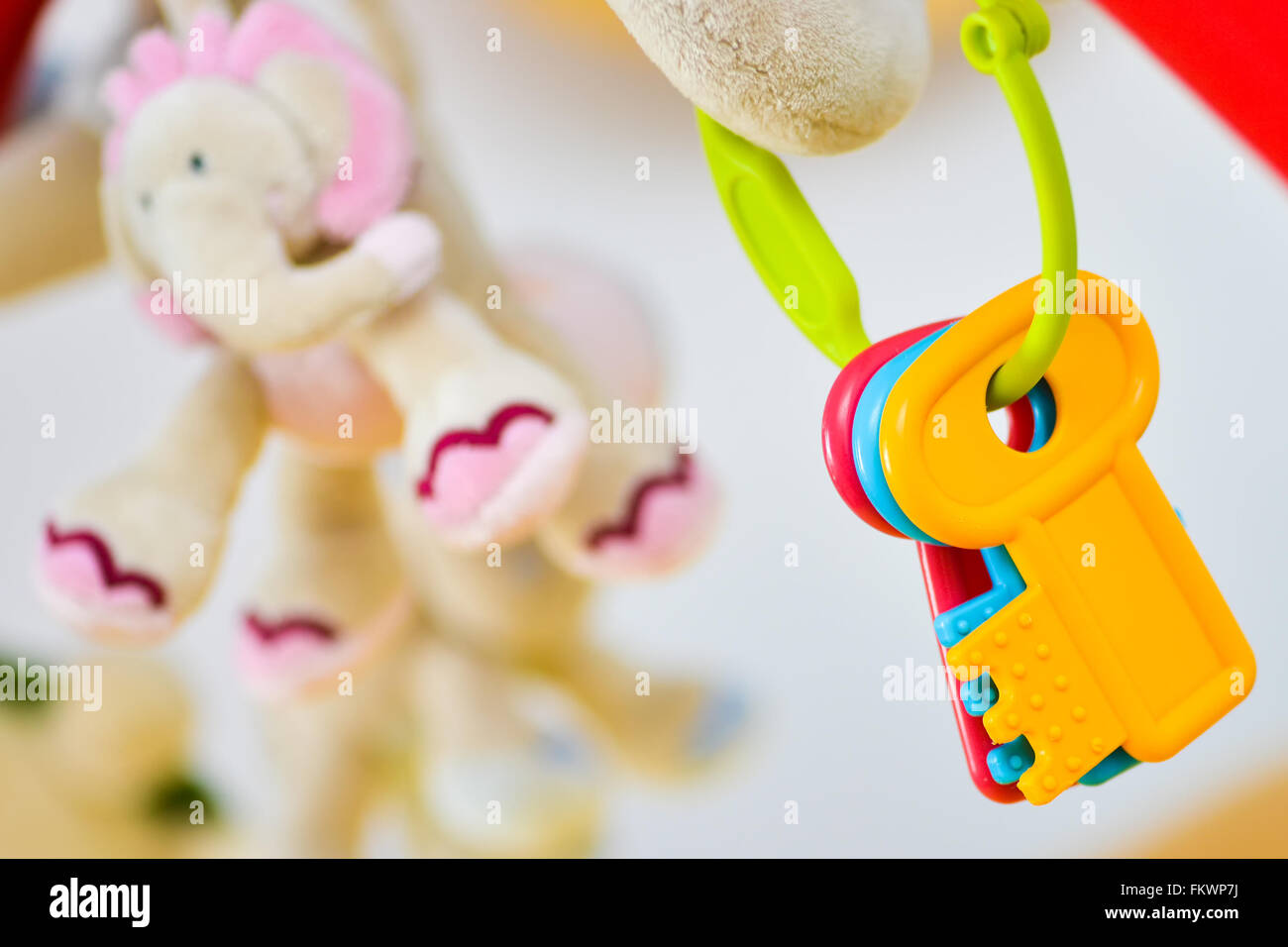 Different colorful toy keys with elephant in background Stock Photo
