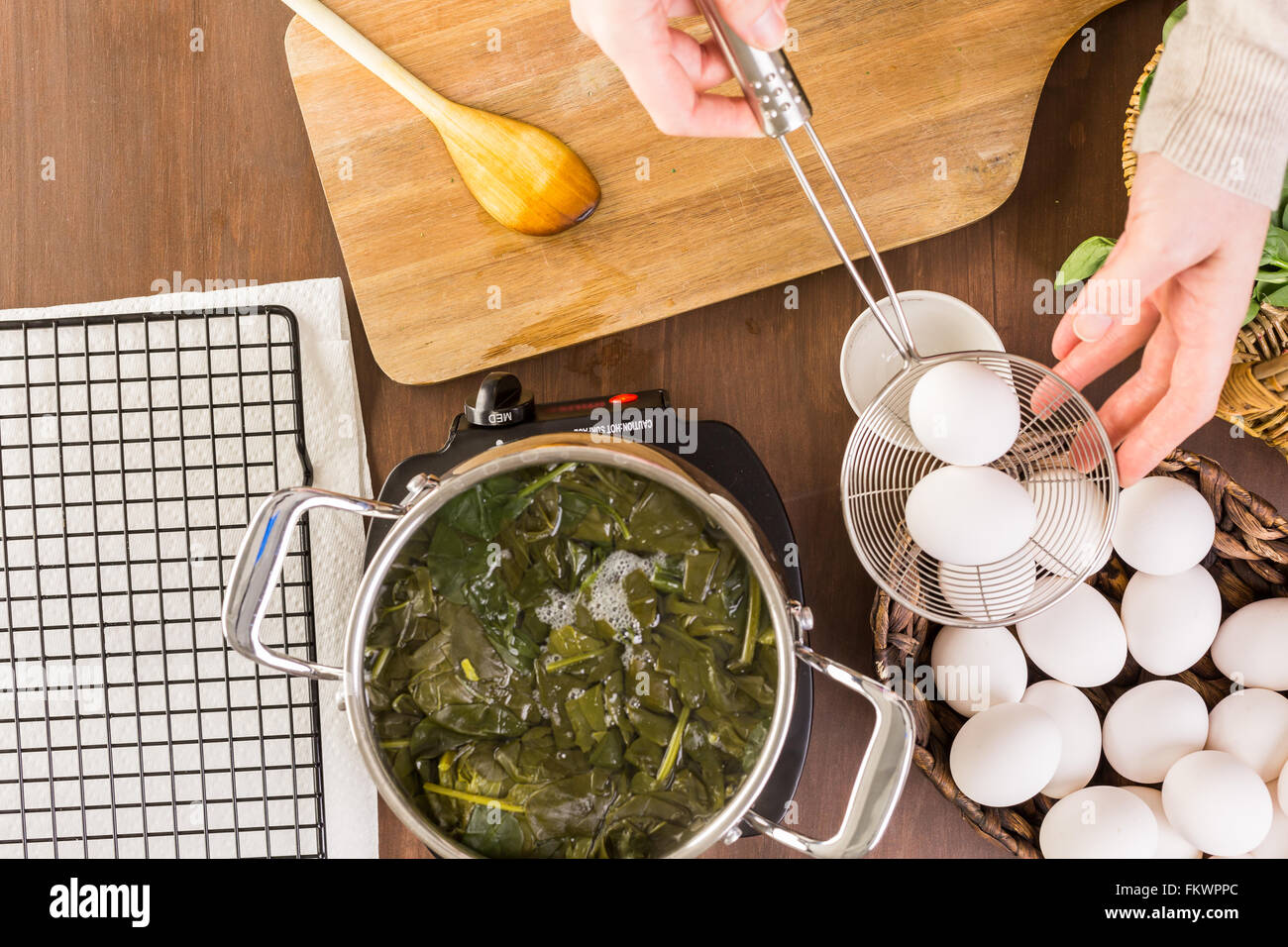 Dyeing Easter eggs with natural dye from spinach Stock Photo Alamy
