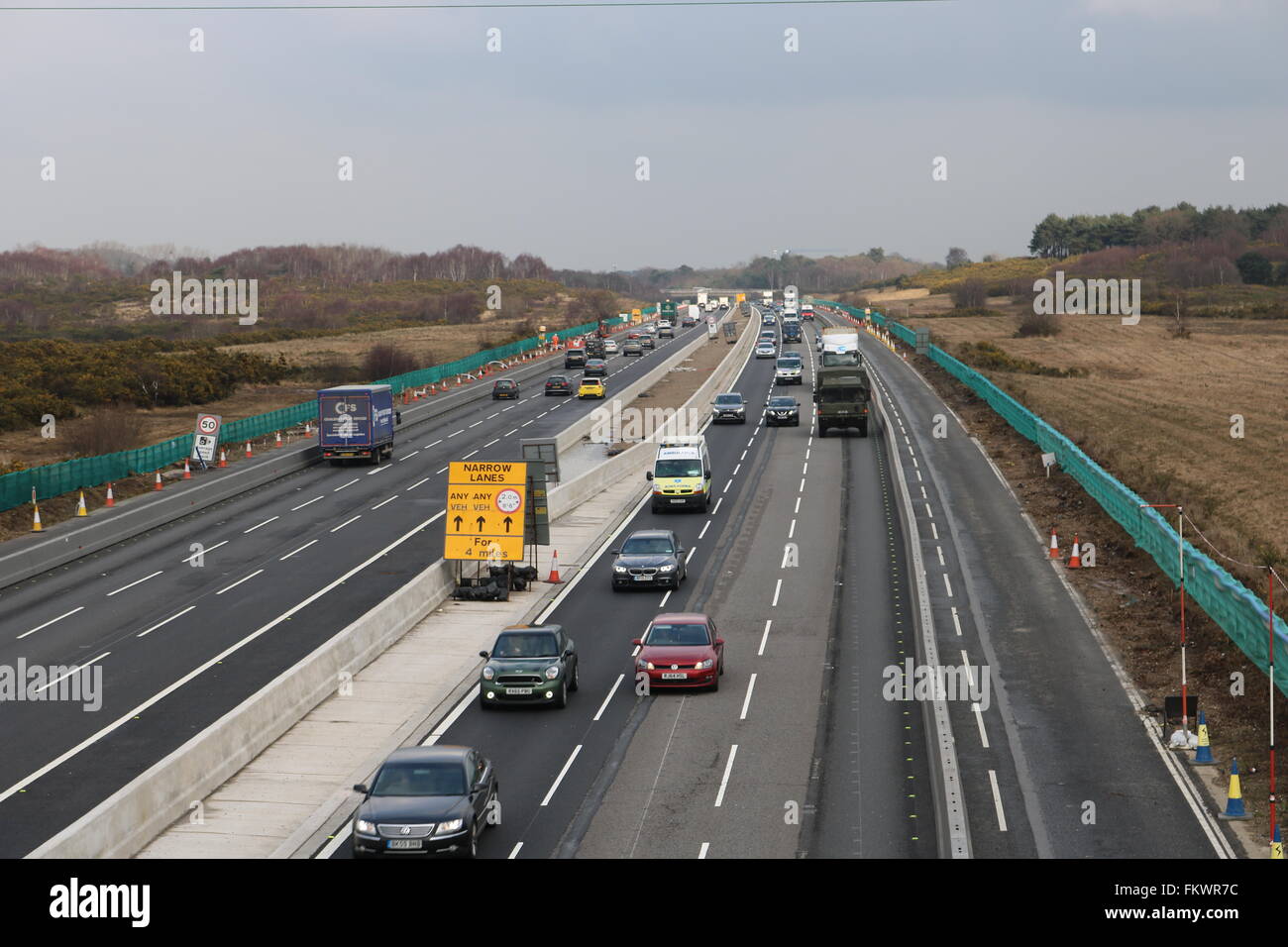 Traffic on the M3 heading out of London, through the roadworks between junctions two and three in Surrey. Stock Photo