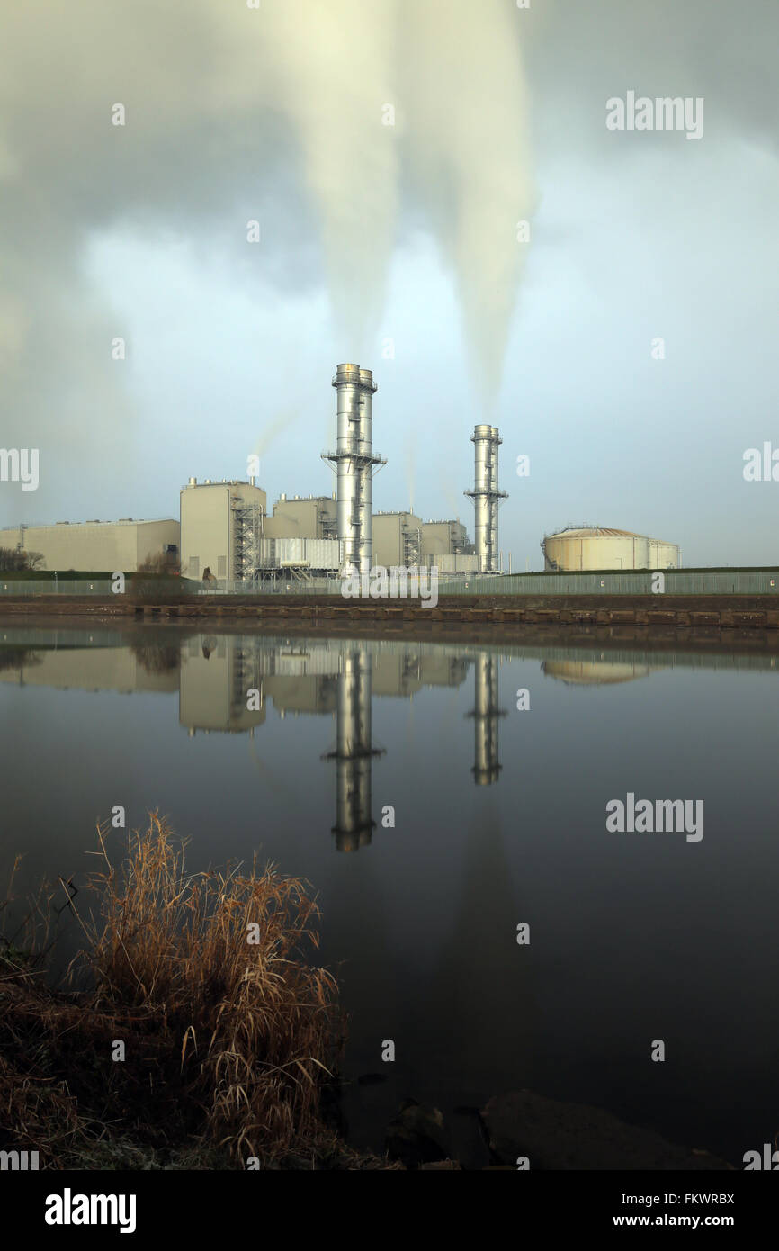 Staythorpe C Power Station near Newark in Nottinghamshire reflected in the waters of the river Trent. Stock Photo
