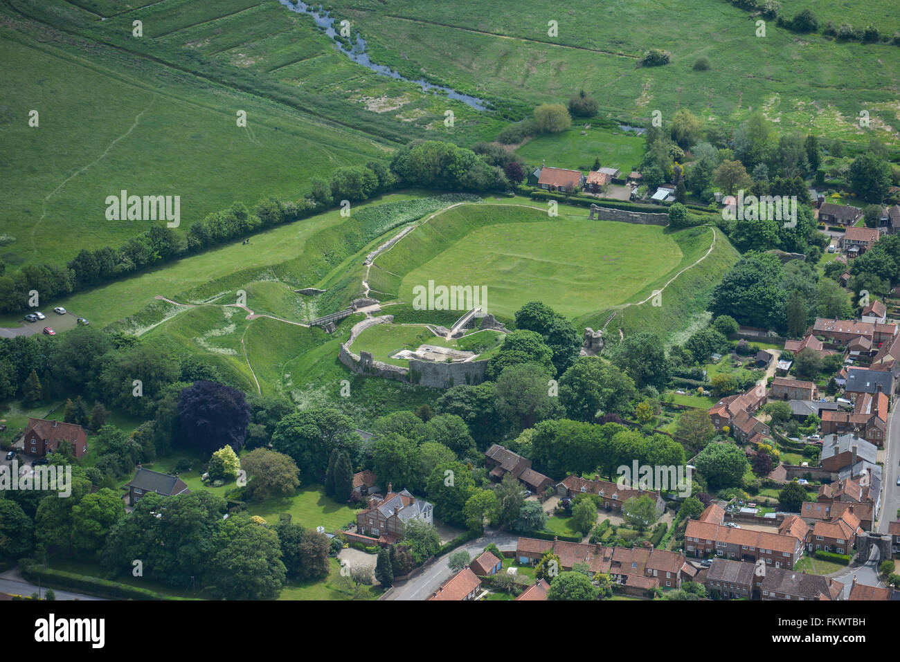 An aerial view of the ruins and earthworks of Castle Acre Castle in Norfolk Stock Photo