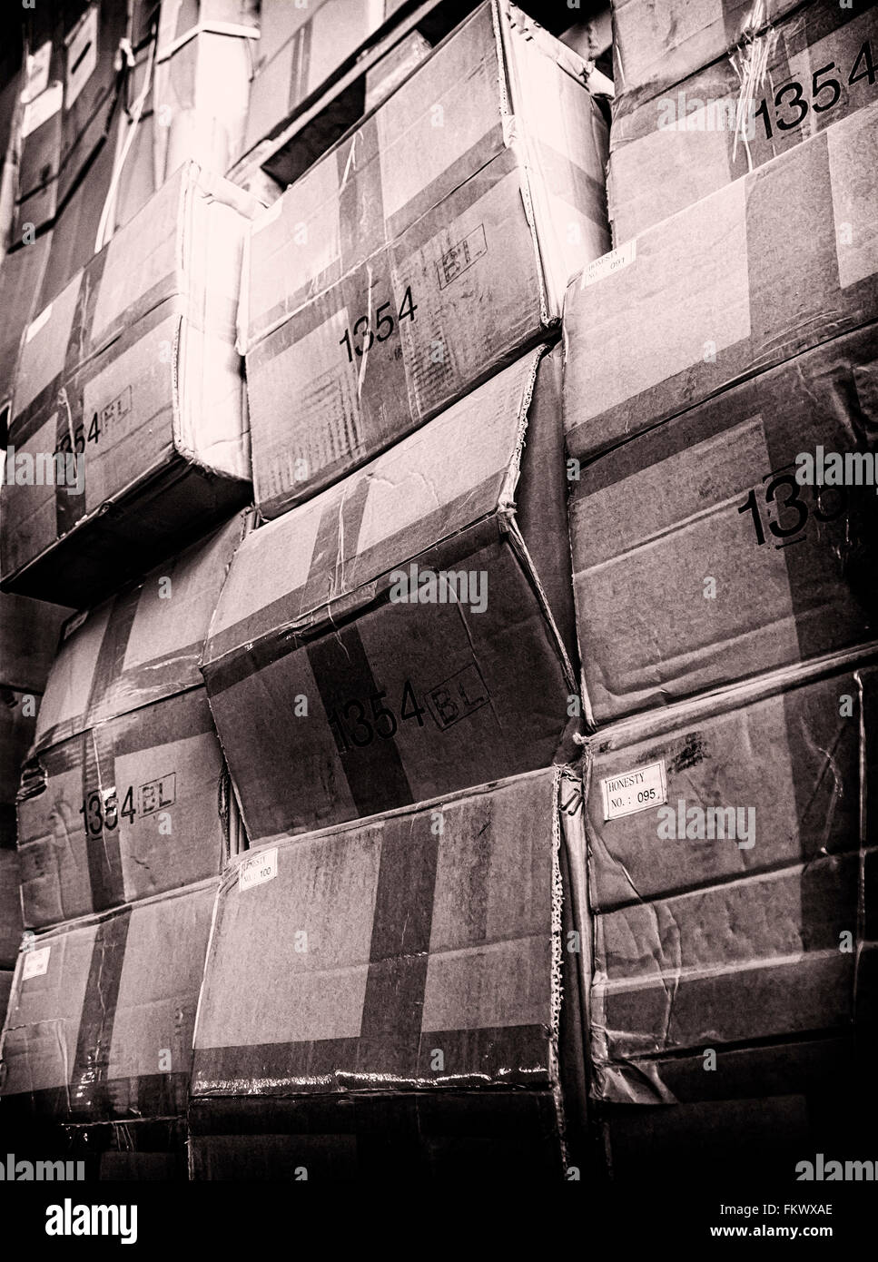 rack stack arrangement of vintage cardboard boxes in a store warehouse, toned photo Stock Photo