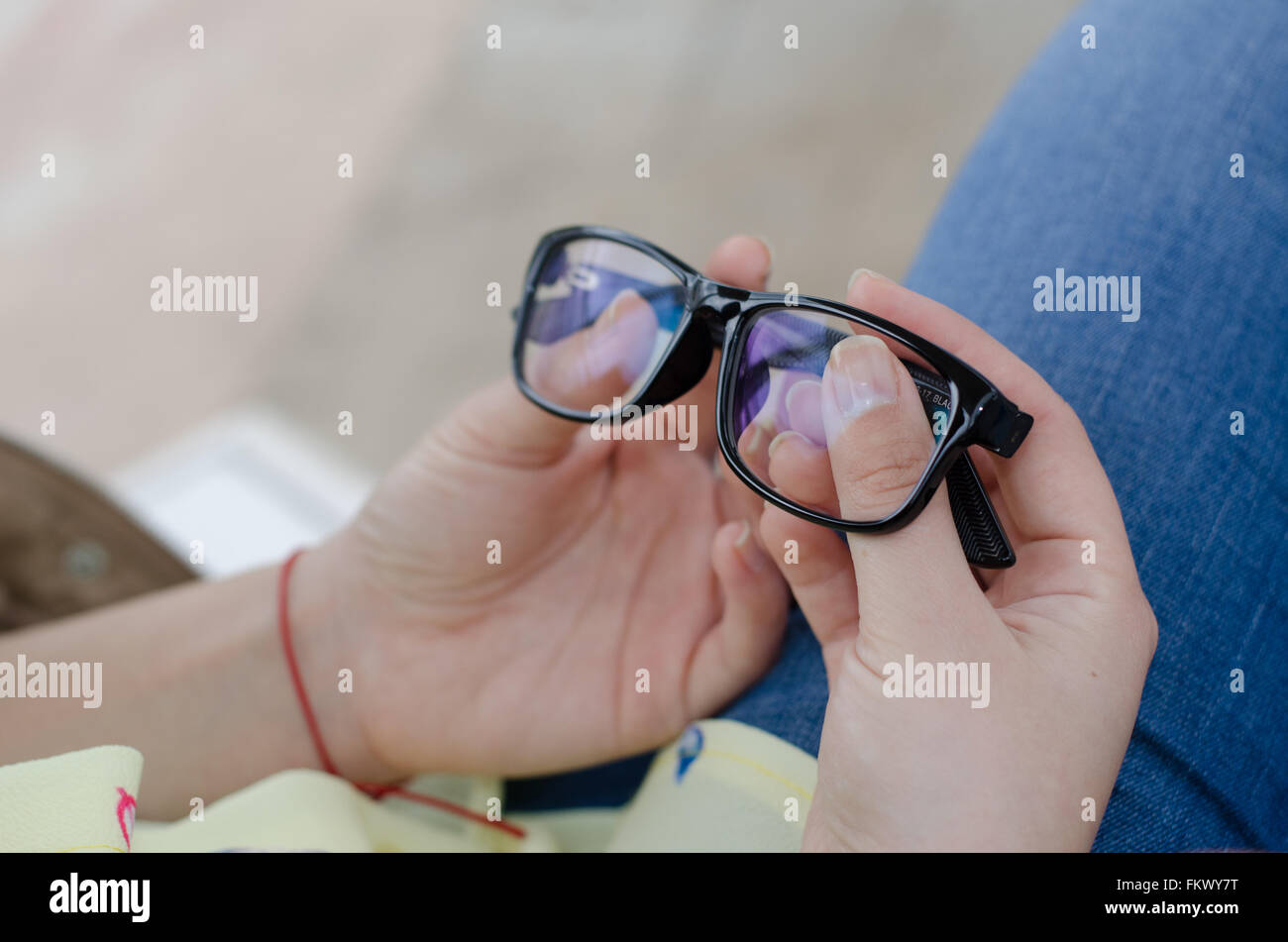 pair of glasses hold in hand at the park Stock Photo Alamy