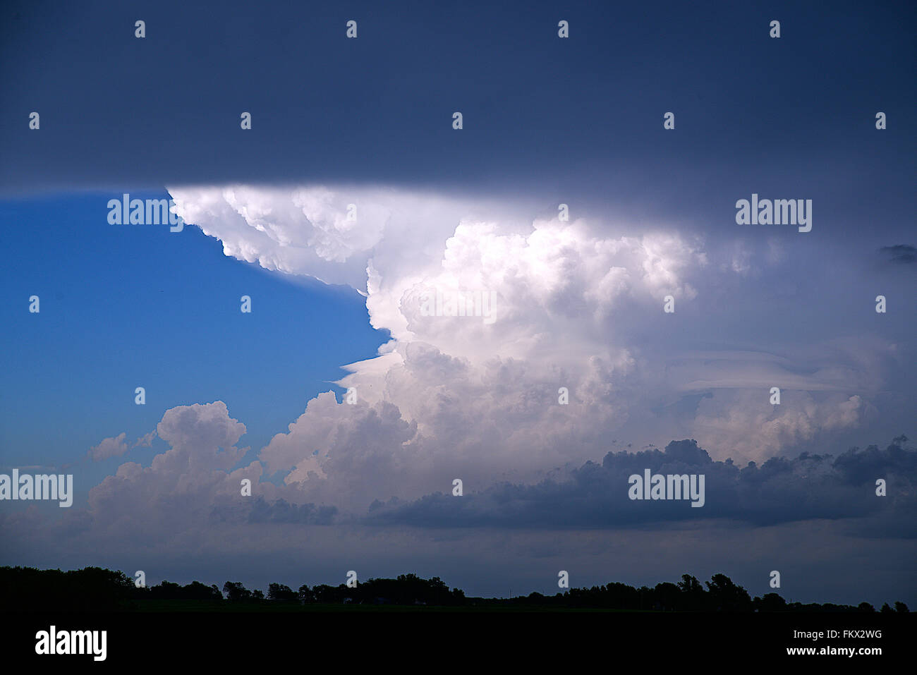 Emporia, Kansas, USA, 13th July, 2015 Cumulonimbus incus  clouds forming north of Emporia, Kansas.  Credit: Mark Reinstein Stock Photo
