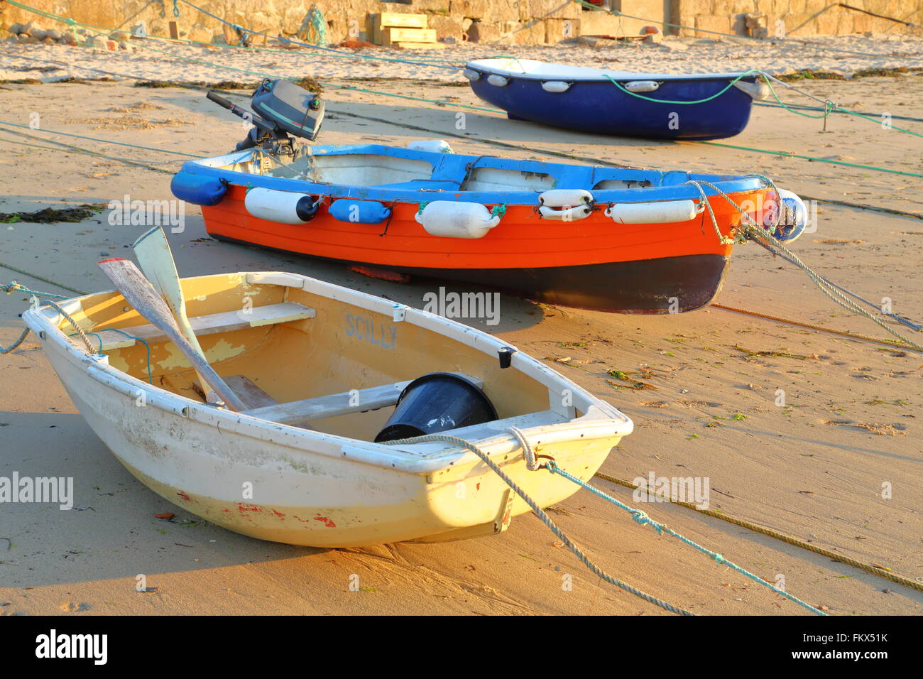 Boats on the beach of St. Mary's, Isles of Scilly, Cornwall. UK at low tide Stock Photo