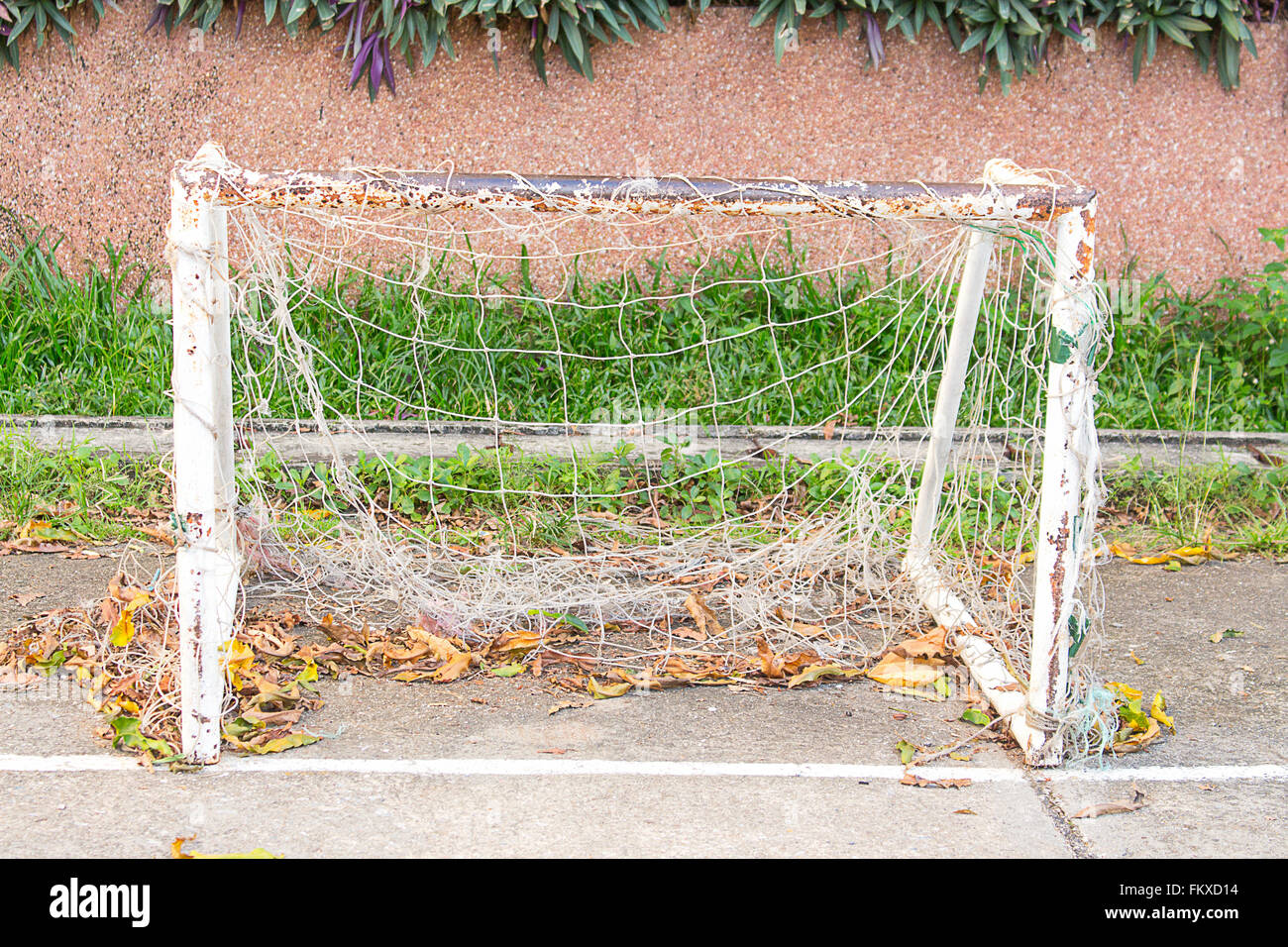 Old soccer goal Waiting for care in southern of Thailand. Stock Photo