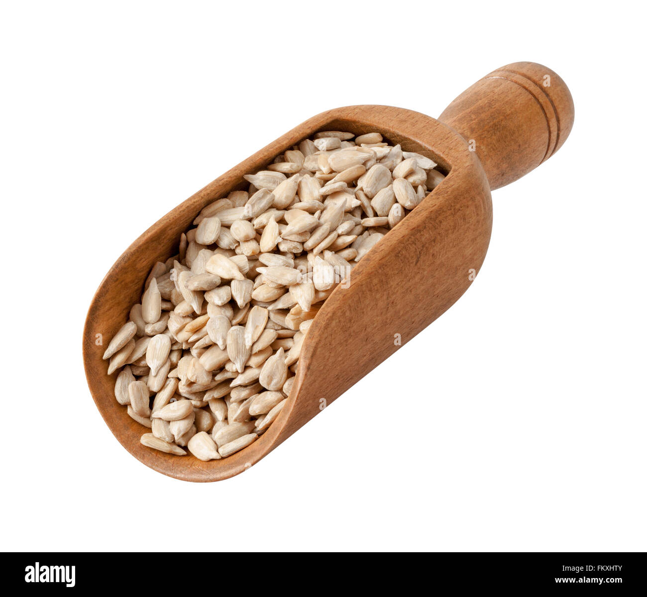 Sunflower Seeds in a Wooden Scoop. The image is a cut out, isolated on a white background. Stock Photo