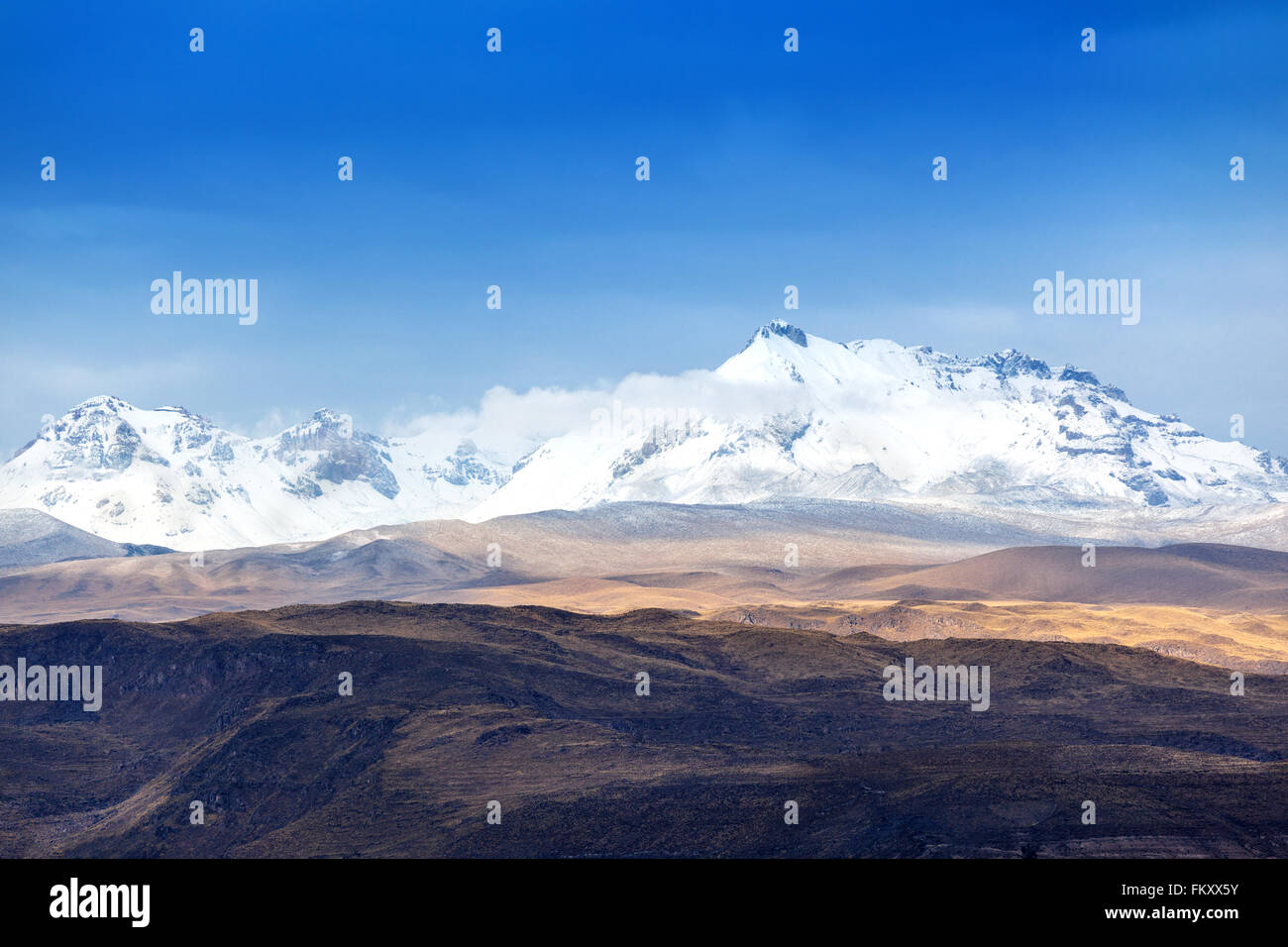 snow-capped mountains on a sunny day Stock Photo - Alamy