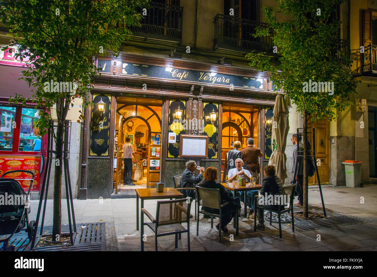 Facade and terrace of Cafe Vergara, night view. Isabel II Square, Madrid, Spain. Stock Photo