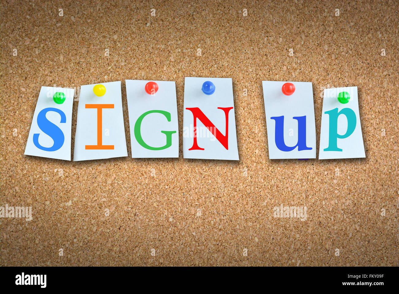 Close-up of words “Sign-up” on cork billboard with sticky notes and colored pins Stock Photo