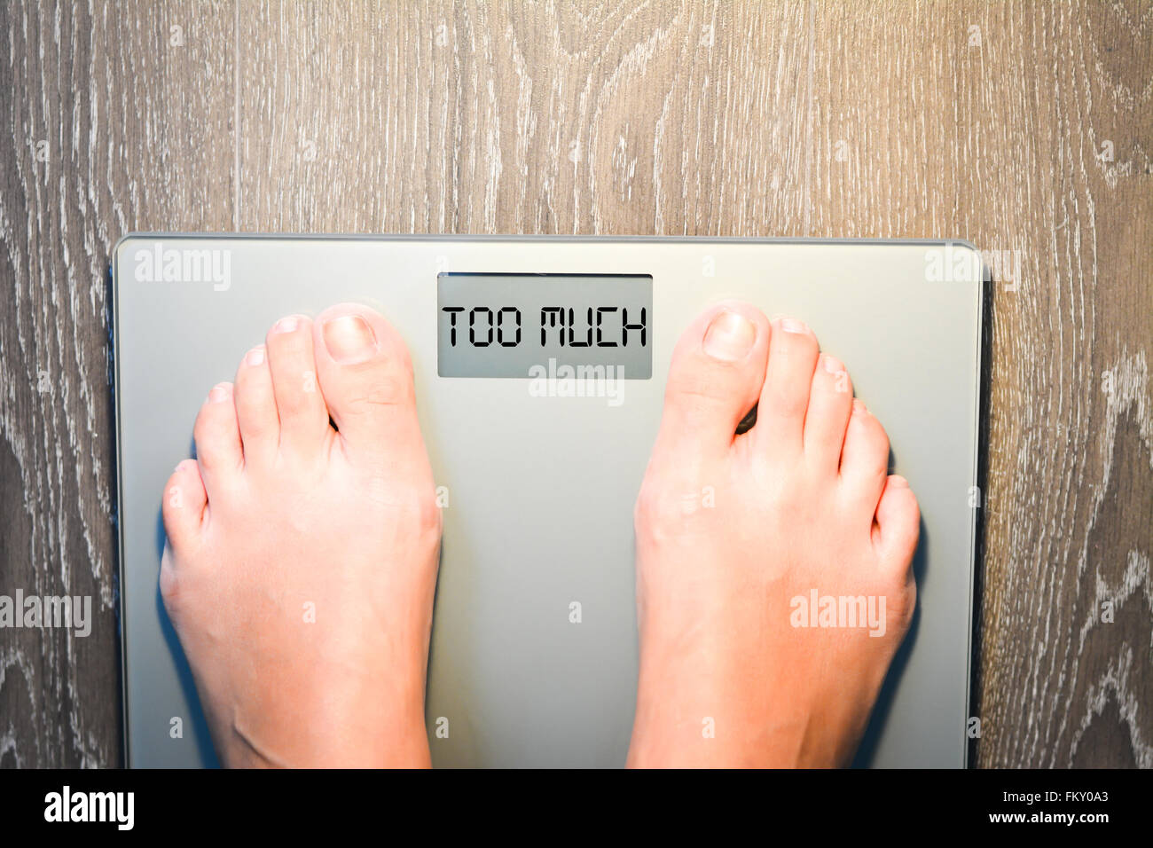 Lose weight concept with person on a scale measuring kilograms Stock