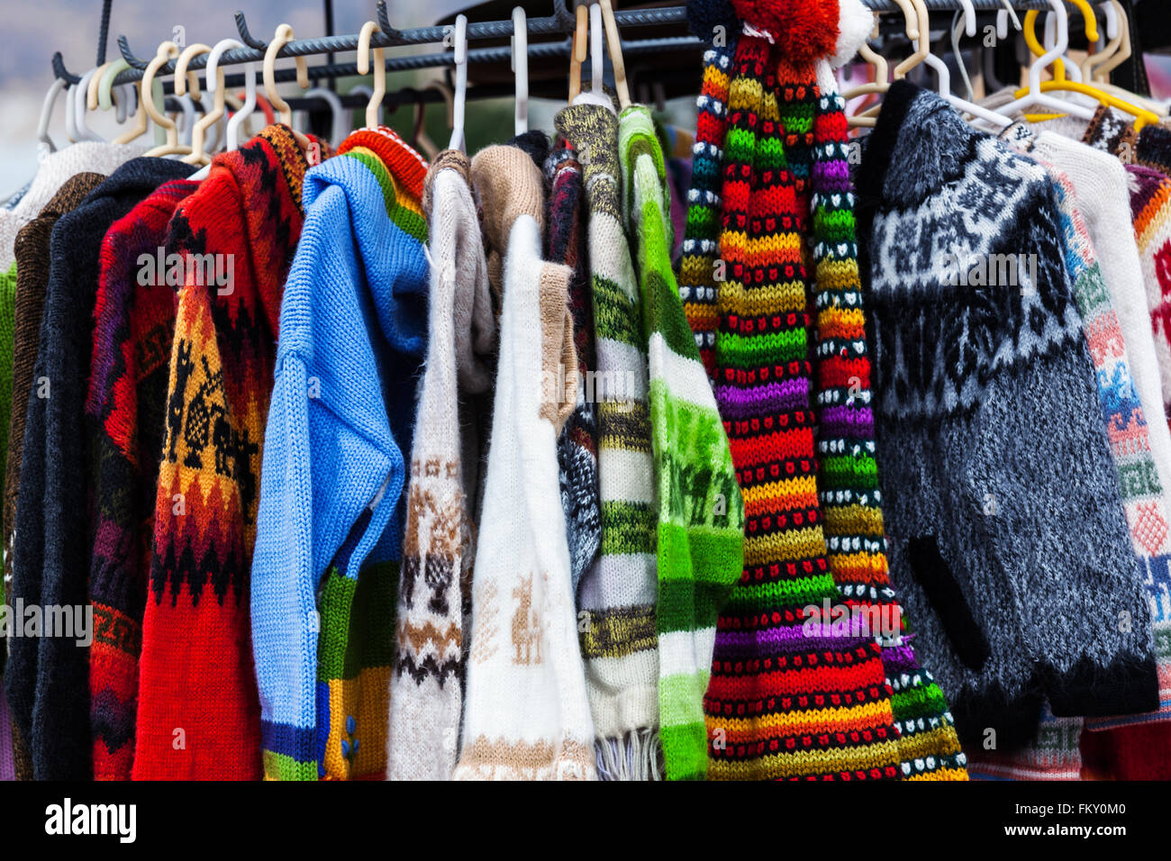 sweaters from alpaca wool on the market in Peru Stock Photo - Alamy