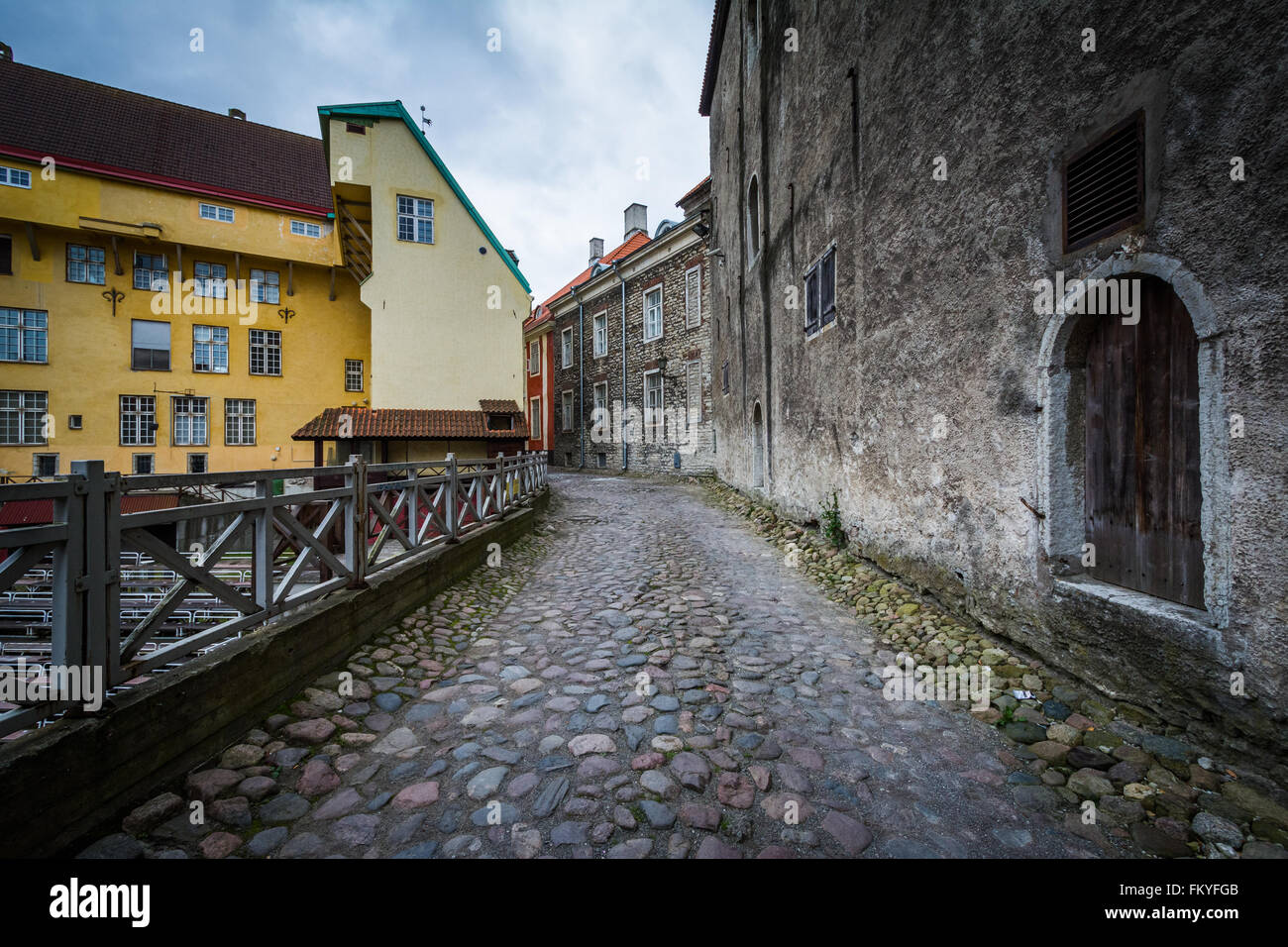Cobblestone street and medieval architecture at night, in the Old Town of Tallinn, Estonia. Stock Photo