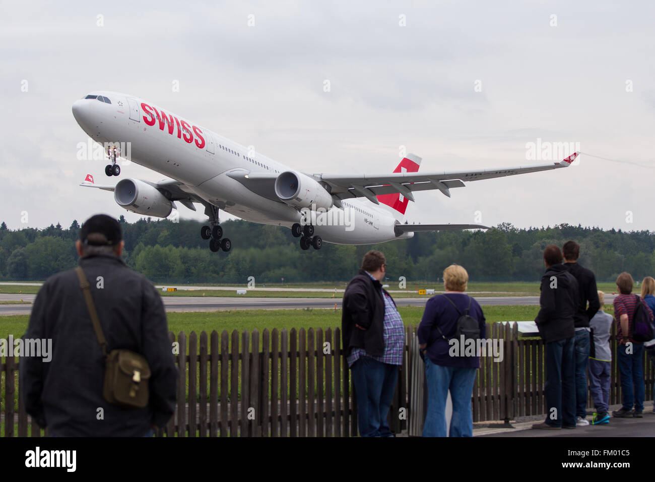 Swiss Airbus A330-300 powerful take off at the famous runway intersection at Zurich Kloten Airport Stock Photo