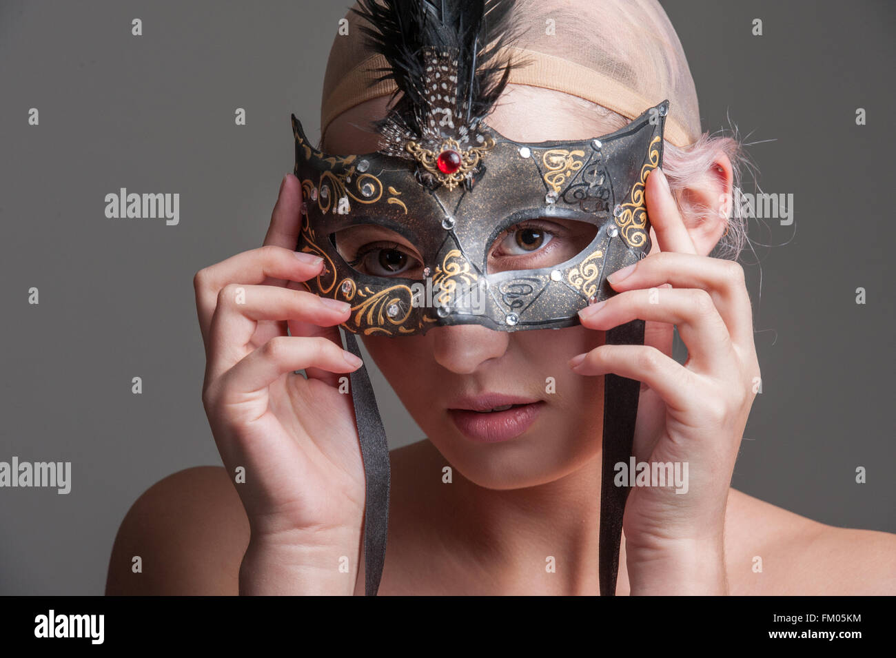 Holding a face mask hi-res stock photography and images - Alamy