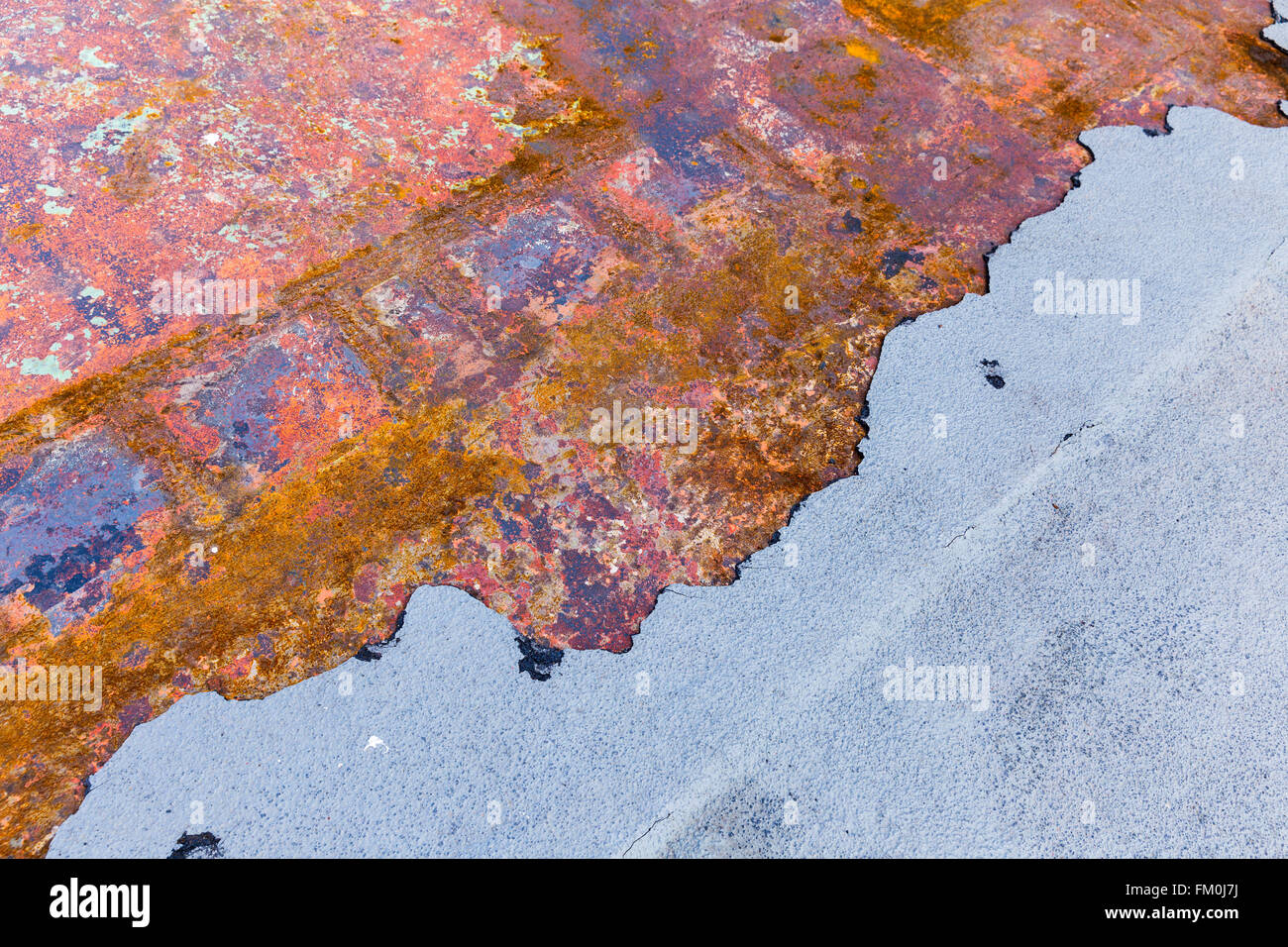 Multicolored old half rusted metal plate background Stock Photo