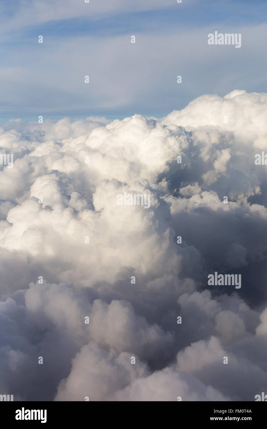 Above the clouds, view from airplane window Stock Photo - Alamy