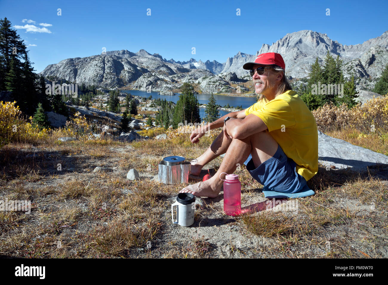 WYOMING - Cooking dinner while overlooking Island Lake and up into Titcomb Basin in Bridger Wilderness area of the Wind Rivers. Stock Photo