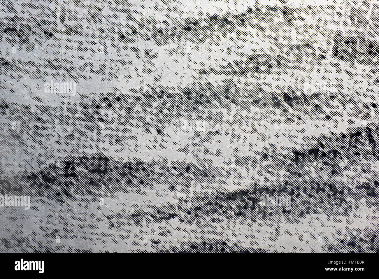 Abstract background of spots and dots in shades of gray with wavy