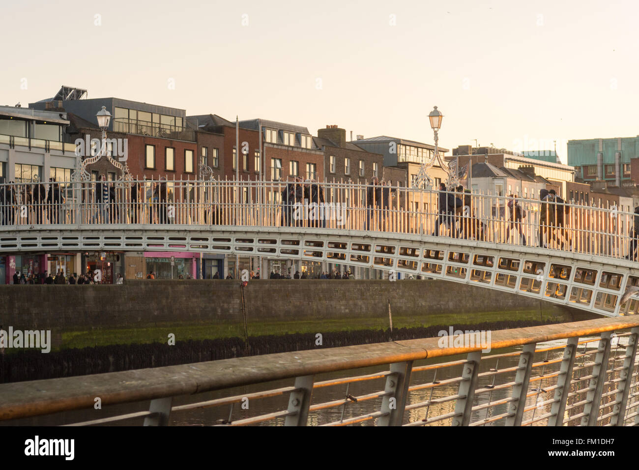 Ha'penny bridge, over the River Liffey at sunset, Dublin, Ireland Stock ...