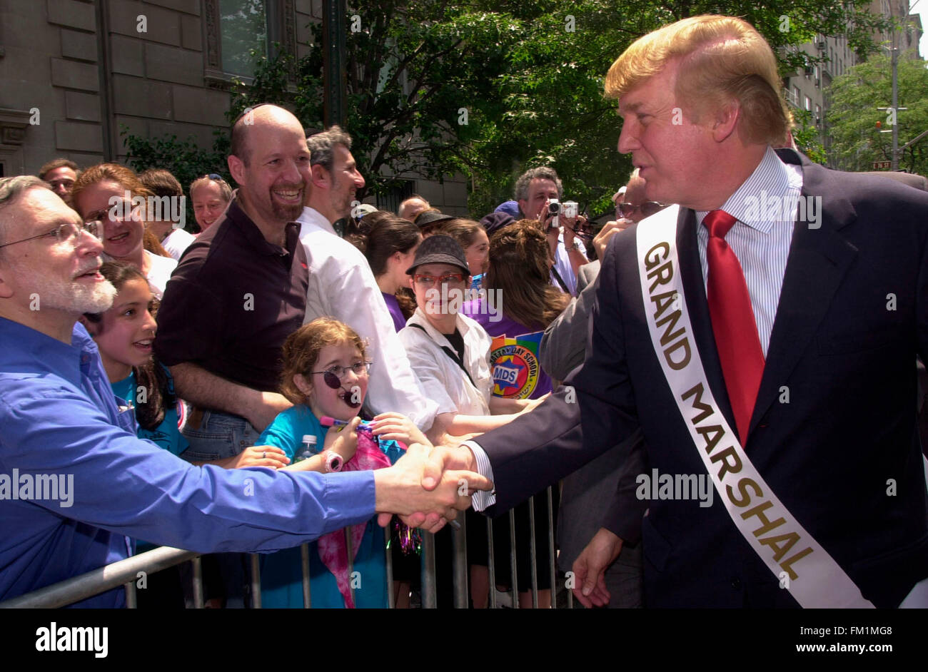 Real Estate mogul Donald Trump greets fans on May 23, 2004 as he marches as Grand Marshal in the 40th annual Salute to Israel Parade on Fifth Ave. The theme of this year's parade was visiting Israel, an effort to revive the sagging economy in the country due to the ongoing Palestinian terrorism. (© Richard B. Levine) Stock Photo