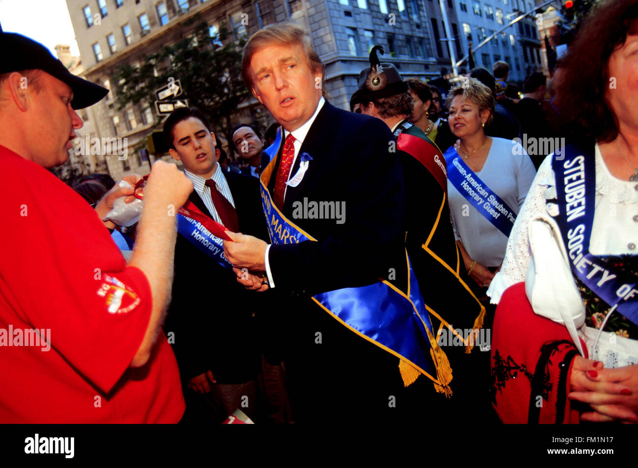 Real Estate Developer Donald Trump receives a ceremonial medal before marching as the Grand Marshal in the 42nd Annual Steuben Day Parade on September 18, 1999. Donald Trump owns considerable real estate in New York City and in Atlantic City and is under investigation by the New York State Lobbying Commission for illegal lobbying by trying to kill casino related legislation in Albany. (© Richard B. Levine) Stock Photo