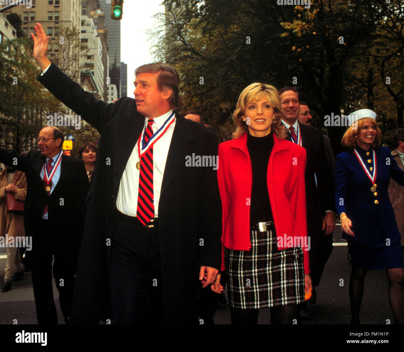 Donald Trump and Marla Maples march in the New York City Veteran's Day Parade on November 11, 1995.  Maples auctioned off a 7.45-carat diamond engagement   ring received from Donald Trump for $110,000 Friday, June 2, 2000.  Trump gave Maples the ring in the early 1990s. Maples and Trump married in 1993 and  divorced in 1997.  (© Frances M. Roberts) Stock Photo