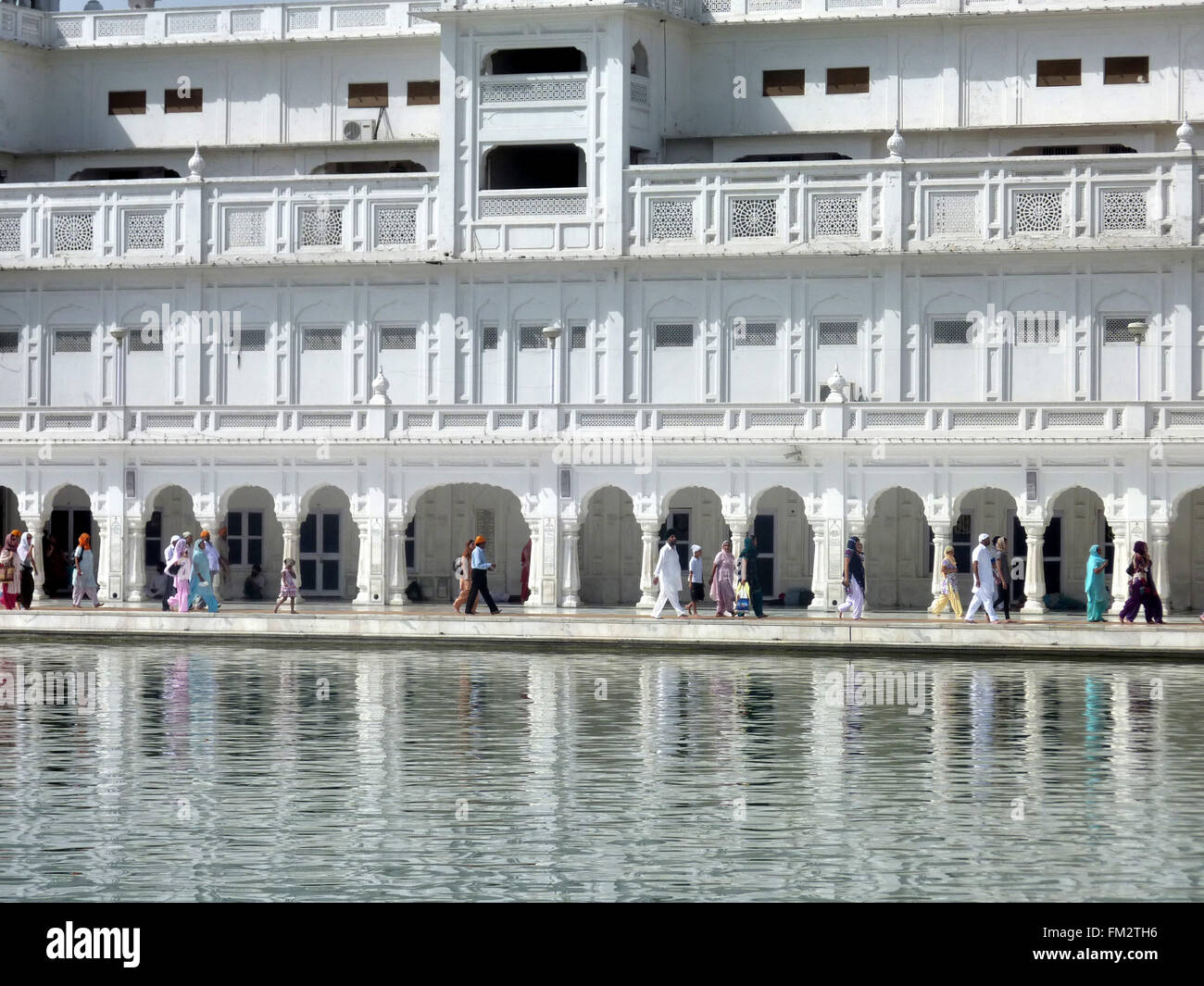 Building complex, Golden Temple, Amritsar, Punjab, India, around Amrit Sarovar, the white building with facilities for pilgrims Stock Photo