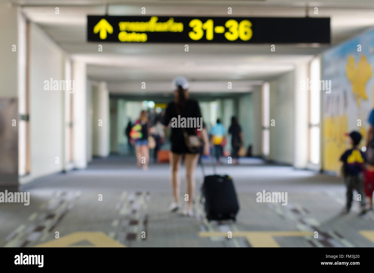 Passengers in Airport on blur background Stock Photo