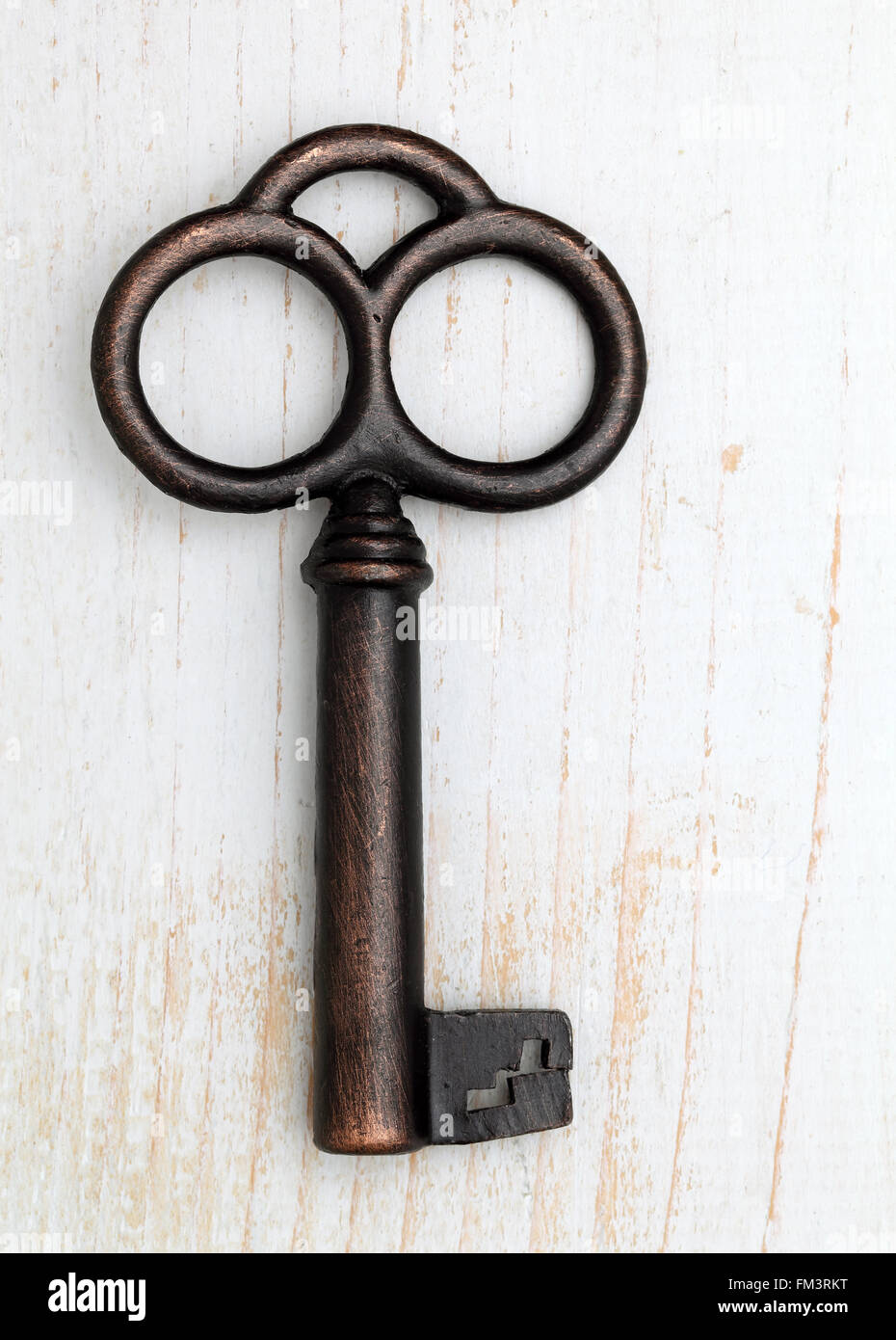 Antique key on white wood background Stock Photo - Alamy