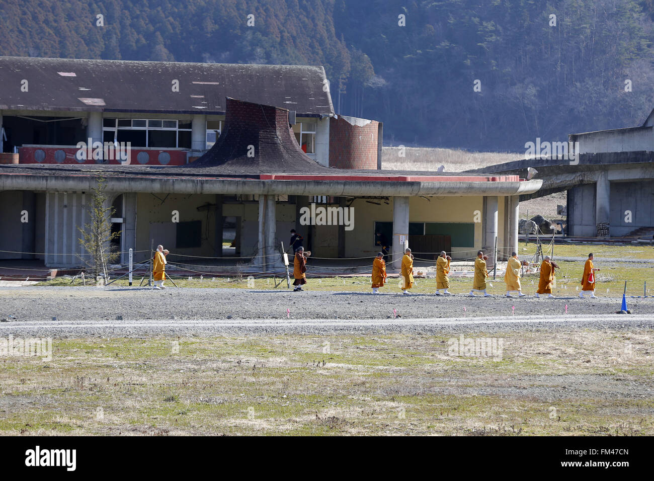 Monks Visit A Shrine At The Ruins Of Okawa Elementary School On March Stock Photo Alamy