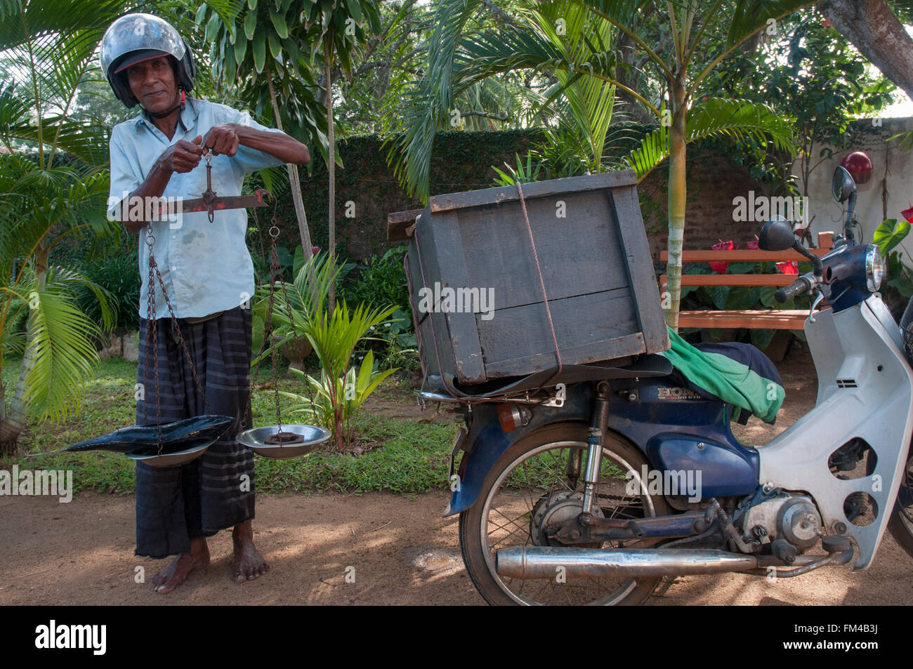 Itinerant vendor selling fresh-caught fish transported from the coast, at Kataragama, Sri Lanka Stock Photo