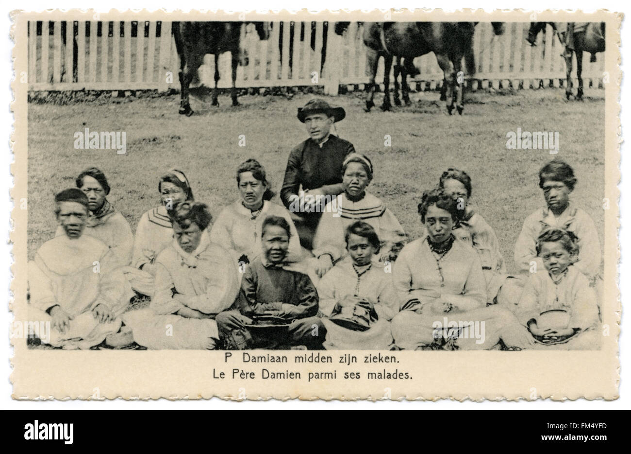 Father Damien, a Catholic missionary and priest, with the Kalawao Girls Choir at the leprosy colony on the island of Molokaʻi, Hawaii in the 1870s. Stock Photo