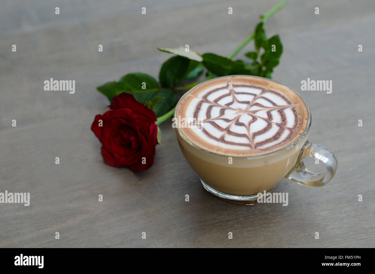 hot latte art coffee on wooden table Stock Photo