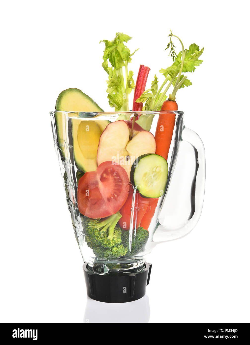 Vegetables in a blender ready for juicing. Healthy eating concept. Stock Photo
