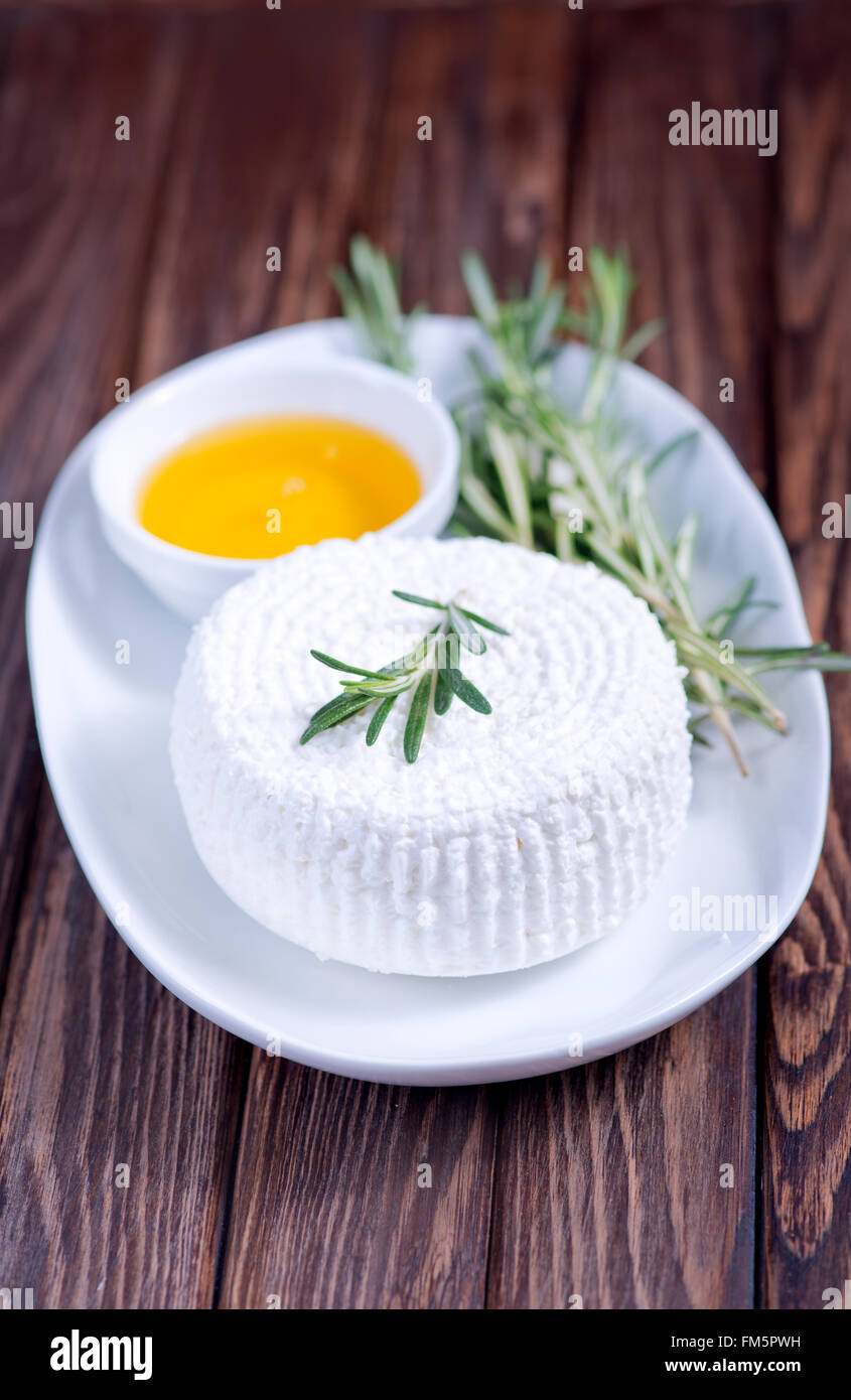 cottage cheese on plate and on a table Stock Photo