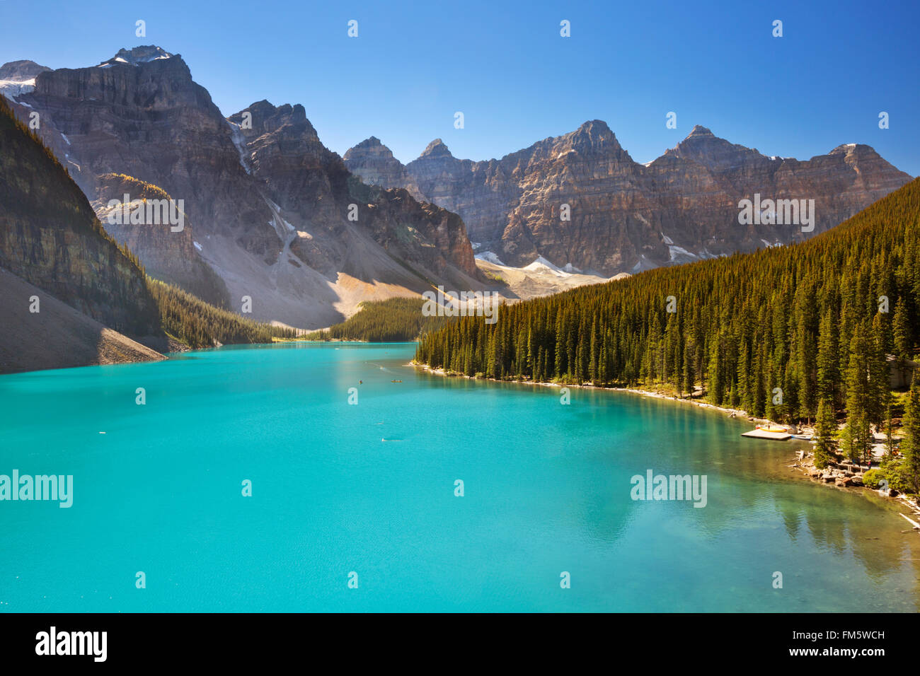 Moraine Lake in Banff National Park, Canada. Photographed on a beautiful sunny day with a clear blue sky. Stock Photo