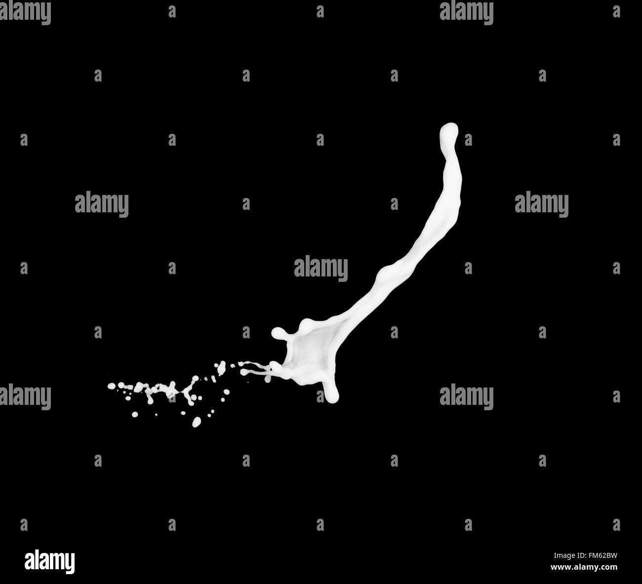 milk splash isolated on black background Stock Photo - Alamy