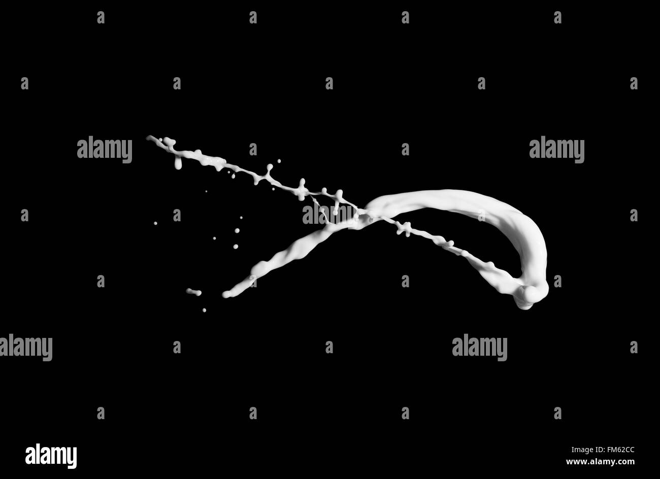 milk splash isolated on black background Stock Photo - Alamy