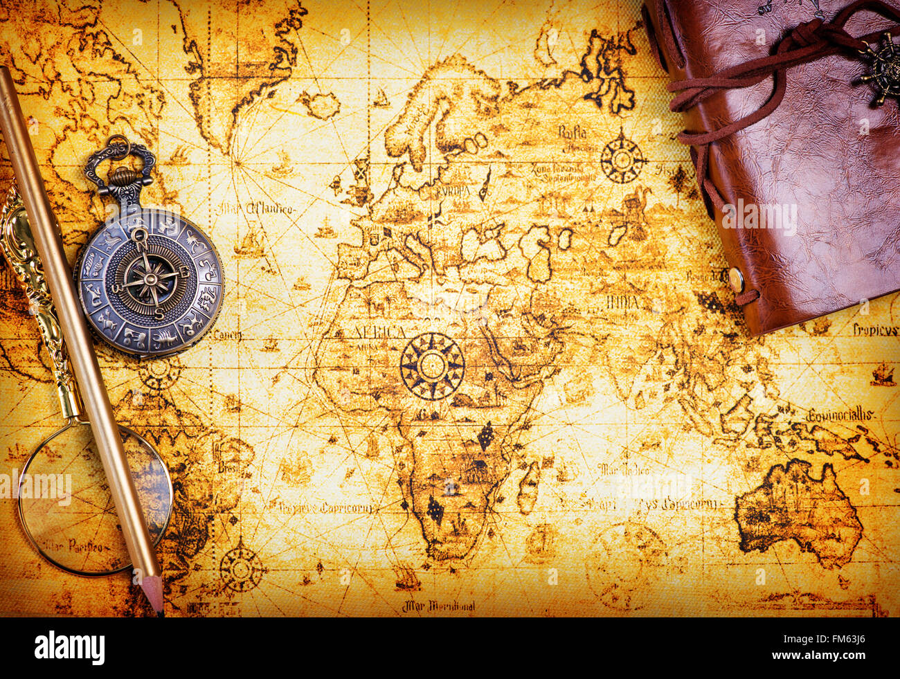 old notebook, loupe and compass on the map Stock Photo - Alamy