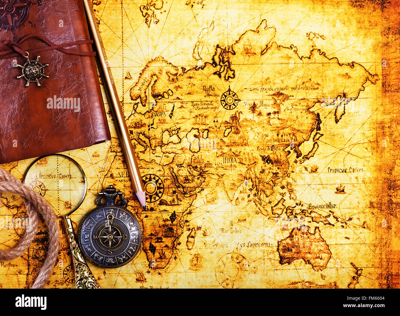 old notebook, loupe and compass on the map Stock Photo - Alamy