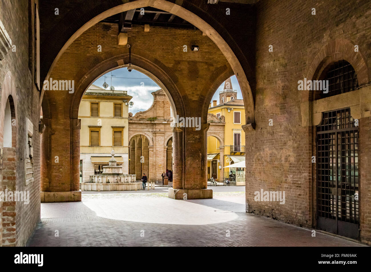 porches with arches and columns in the main square of Rimini in Italy ...