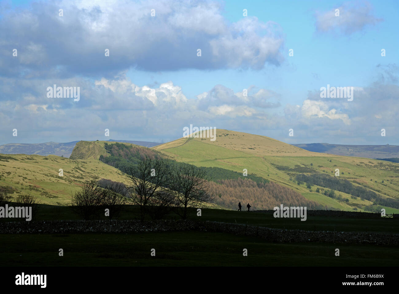 Two hikers walking in Hope Valley in the Peak District of Derbyshire, England. Stock Photo