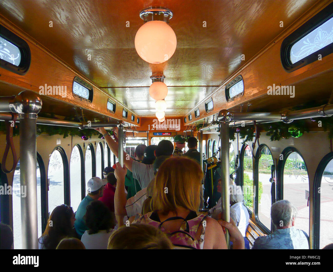 Passengers packed into the I-Drive Trolley bus which runs on International Drive, Orlando, Florida Stock Photo