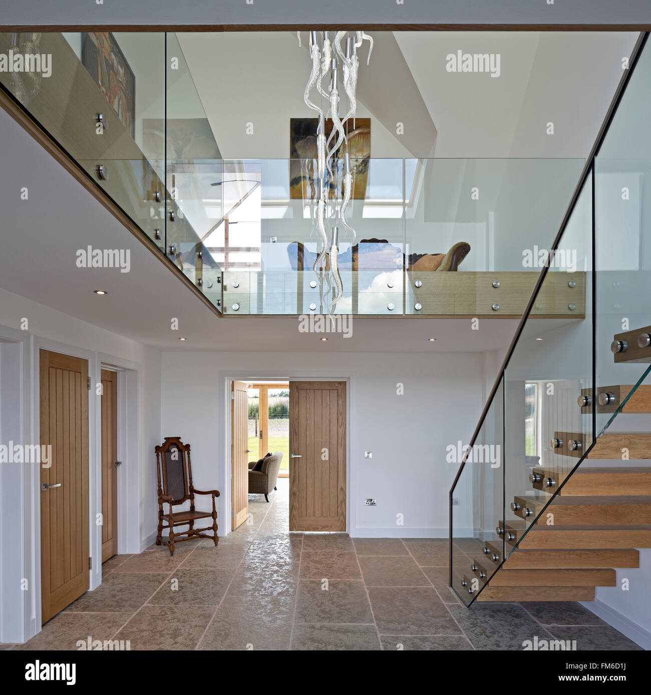 An interior view of a modern residential property called the Amor House, in Gleneagles, showing the entrance hall and staircase. Stock Photo