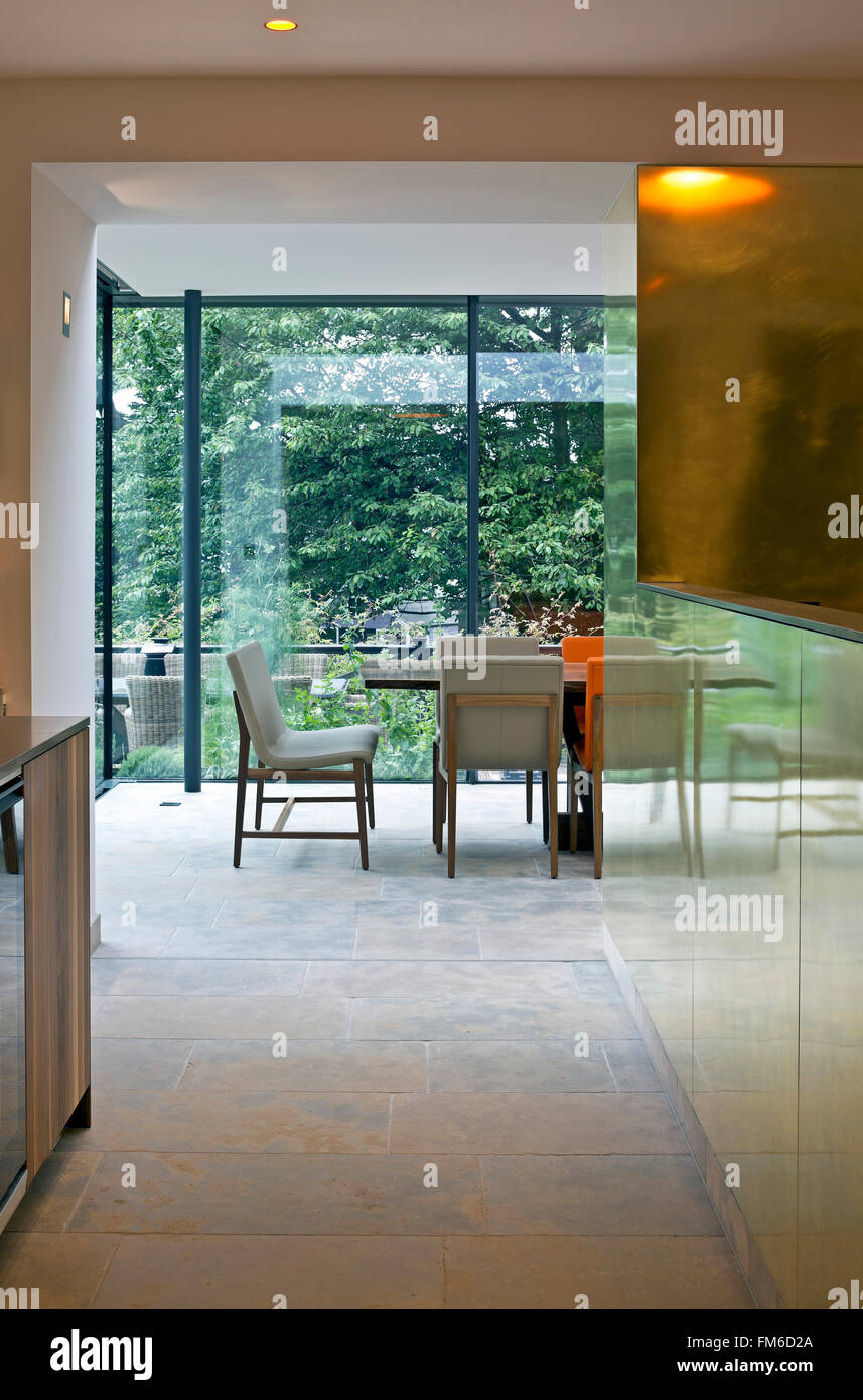 An interior view of an ultra modern residential building showing the modern interior design, taken from the hall looking towards the dining room. Stock Photo
