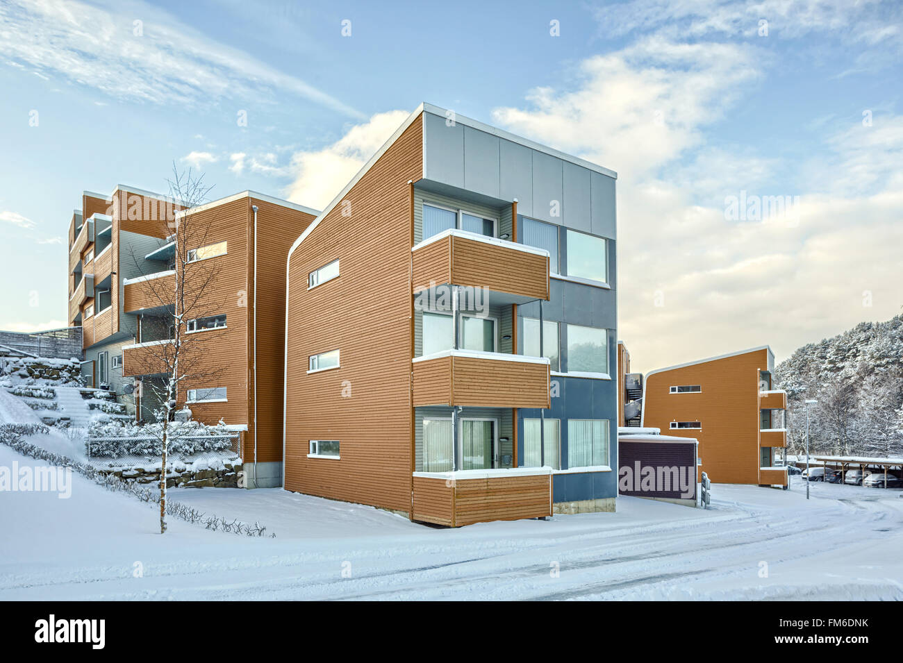 An exterior view of low rise residential housing, in Sandes. With snow on the ground. Stock Photo